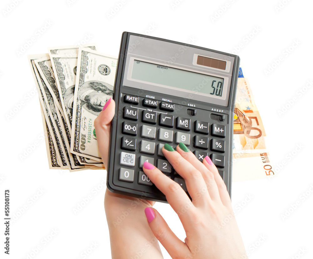 Calculator in woman's hands, money background Calculator in woman's hands, money background