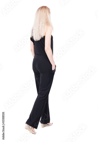 back view of standing young beautiful blonde