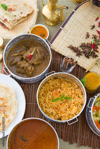 Biryani basmati mutton rice with traditional items on background photo