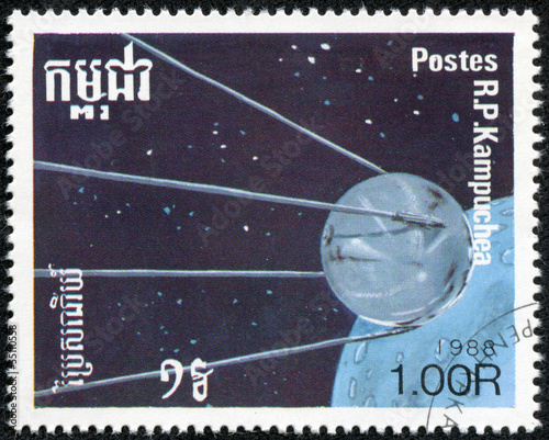 stamp printed by Cambodia, shows space-station and planet photo