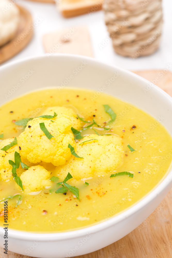 cauliflower soup with curry in a white bowl, close-up cauliflower soup with curry in a white bowl, close-up