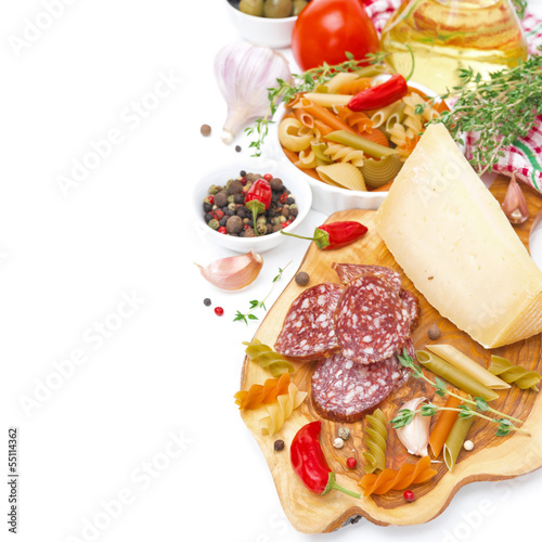 Italian food-cheese, sausage, pasta, spices, tomatoes, isolated