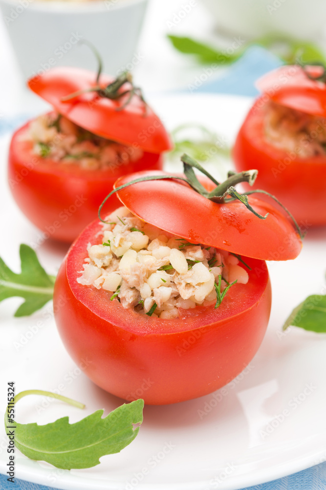 tomatoes stuffed with tuna salad and bulgur on the plate tomatoes stuffed with tuna salad and bulgur on the plate