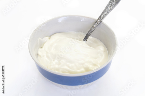 Mayonnaise in cup with spoon