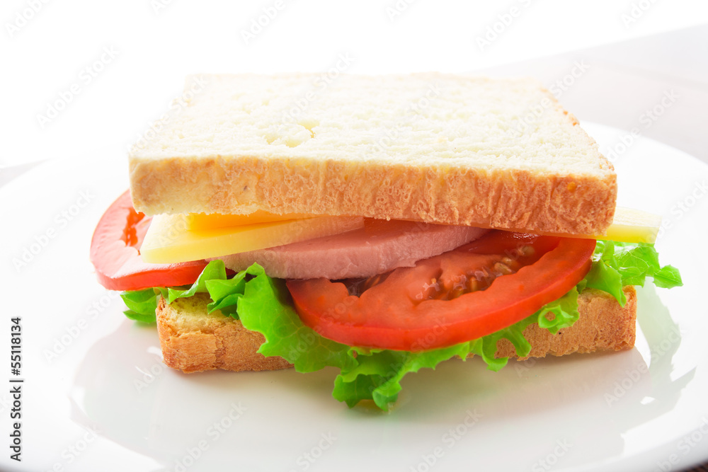 Sandwich with ham, cheese and tomato Sandwich with ham, cheese and tomato