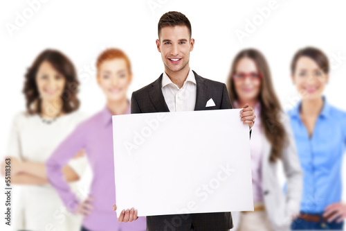 Successful businessman leading a group with board