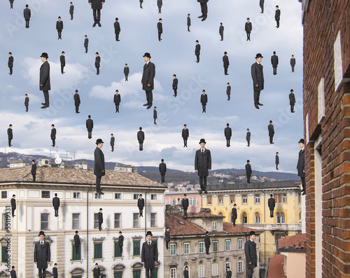 businessmen floating in the sky over european city, magritte sty photo