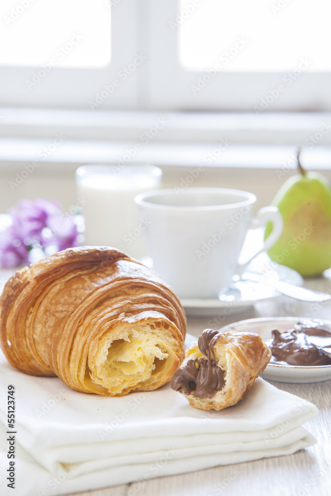 Croissants with chocolate, milk and coffee, delicious breakfast Croissants with chocolate, milk and coffee, delicious breakfast