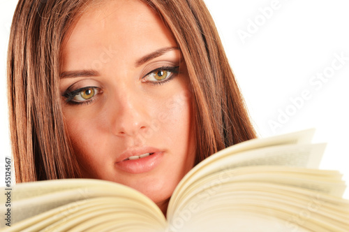 Young woman reading a book. Female student learning