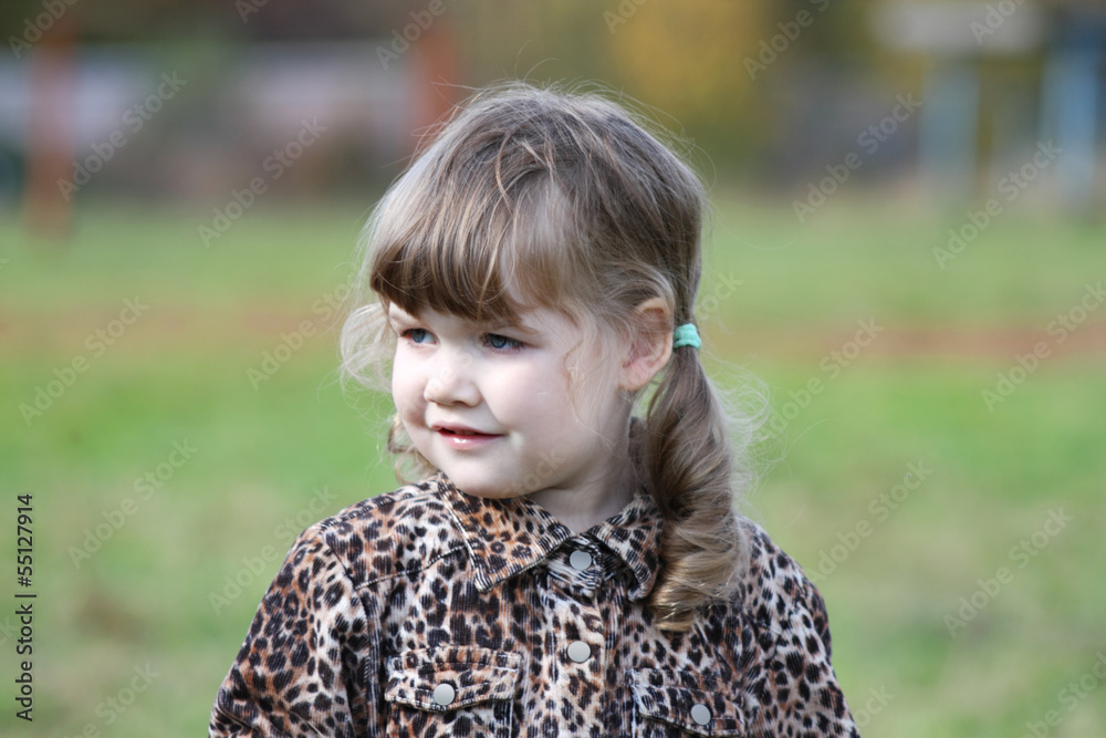 Little cute girl in overcoat looks at distance at autumn day. Little cute girl in overcoat looks at distance at autumn day.