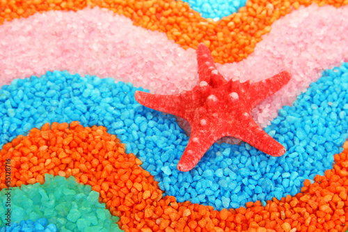 Starfish on colorful crystals of sea salt background