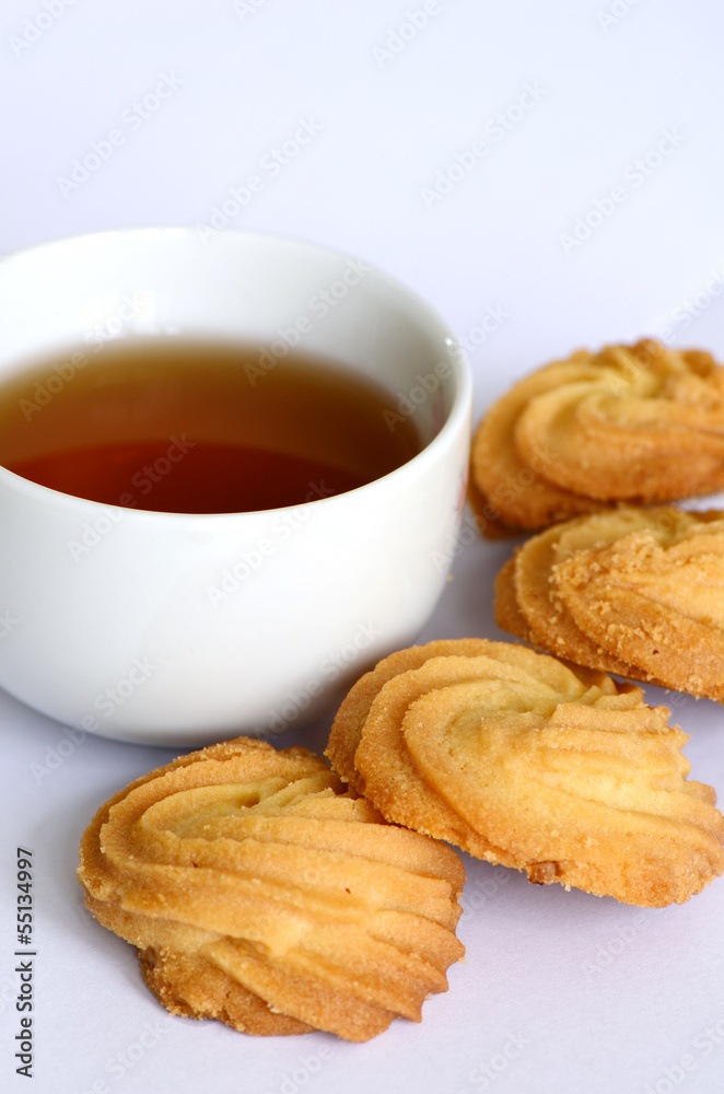 Butter cookies and a cup of tea. Butter cookies and a cup of tea.
