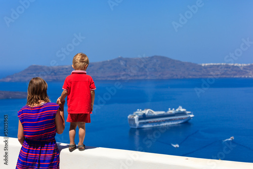 family looking at Santorini, Greece