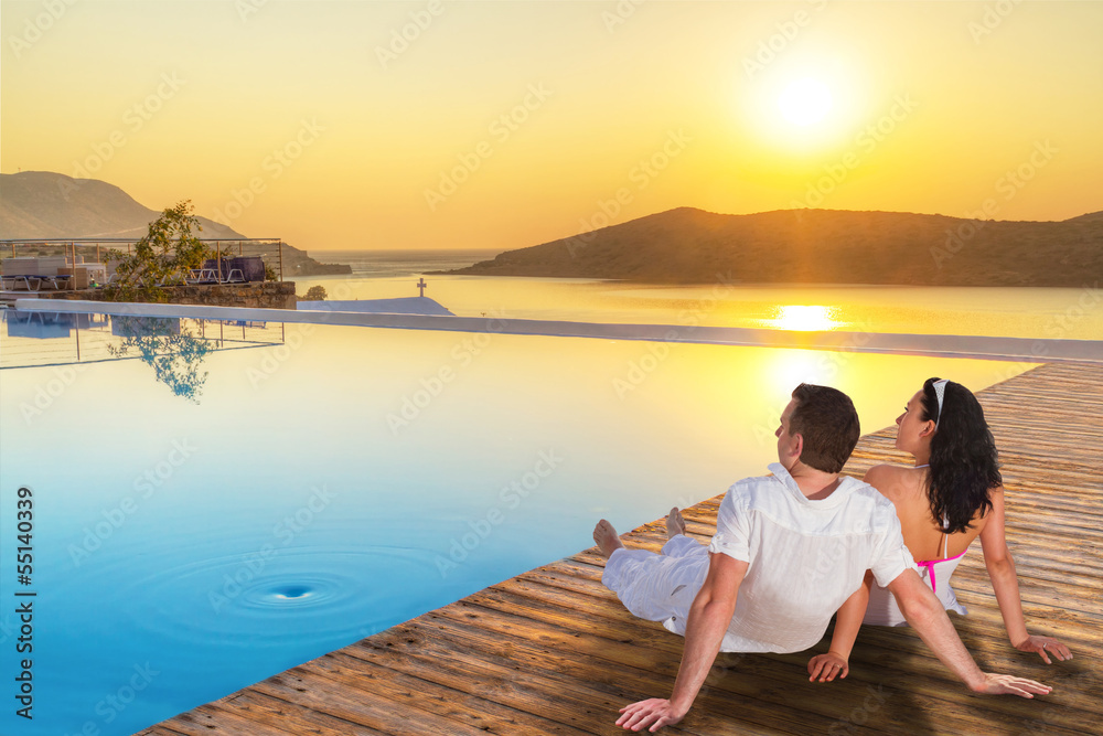 Fototapeta premium Couple watching together sunrise in Greece