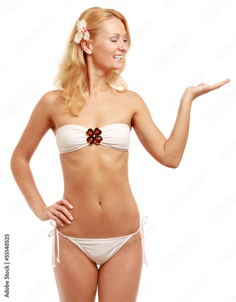 A young woman in a swimsuit showing something A young woman in a swimsuit showing something