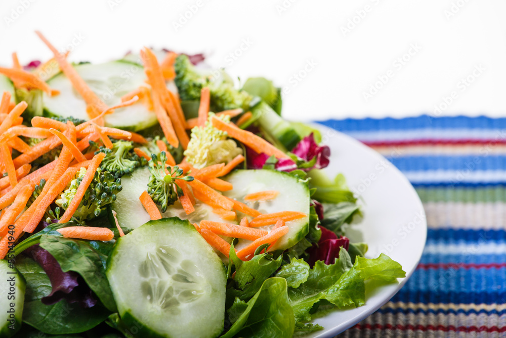 Fresh Vegetable Salad on Colorful Placemat