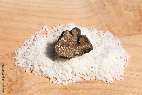 Tuber Micheli with rice on wood