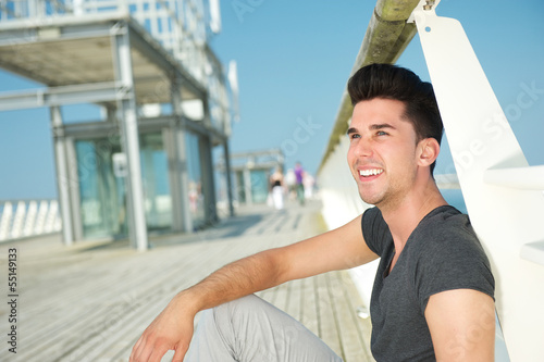 Free Download Attractive caucasian male smiling outdoors - GFXLoad