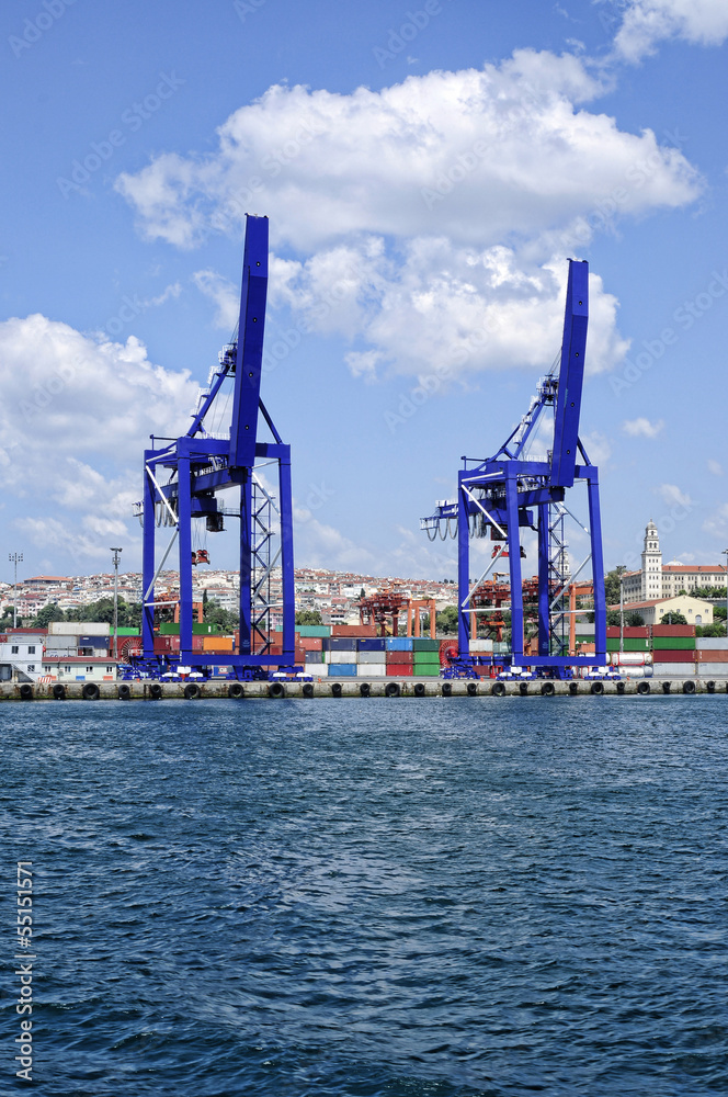 Cargo ship, containers and cranes in sea port
