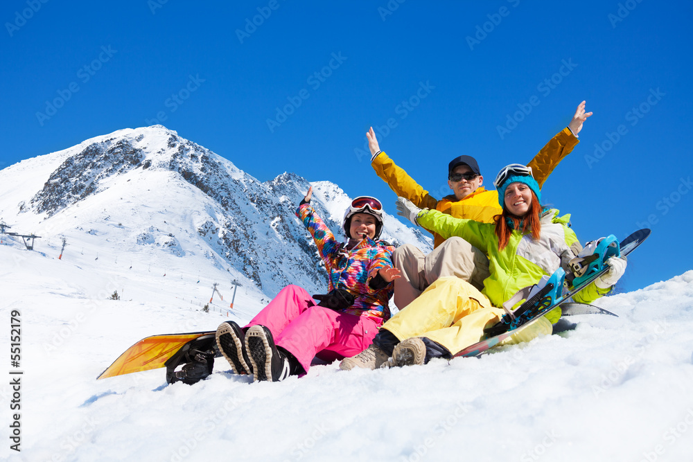 Three students in snow with snowboards