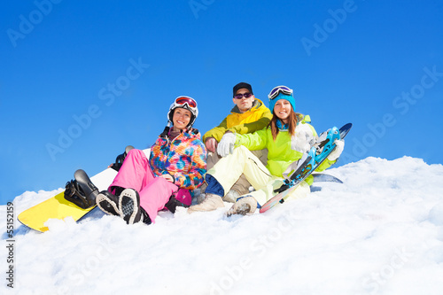 Three snowboarders