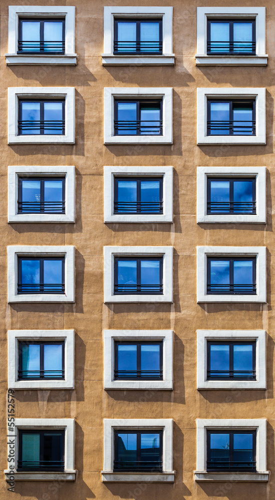 Window Pattern on a Brown Facade