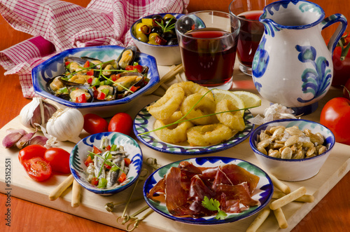Spanish Cuisine. Assorted tapas on ceramic plates.