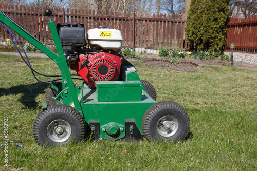 Man working with Lawn Aerator
