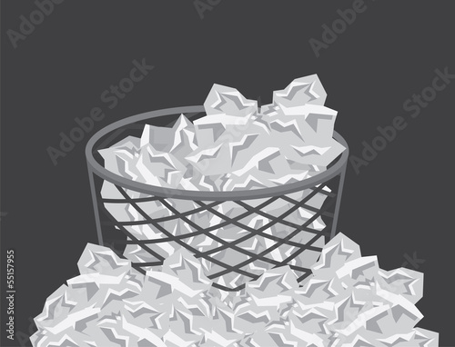 Garbage can overflowing with paper trash