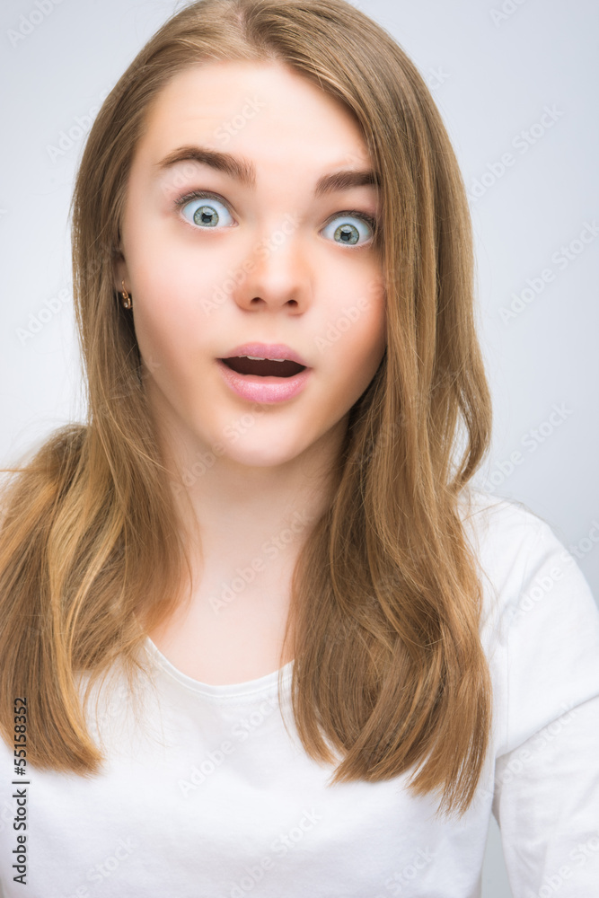 portrait of surprised teenage girl isoalted portrait of surprised teenage girl isoalted