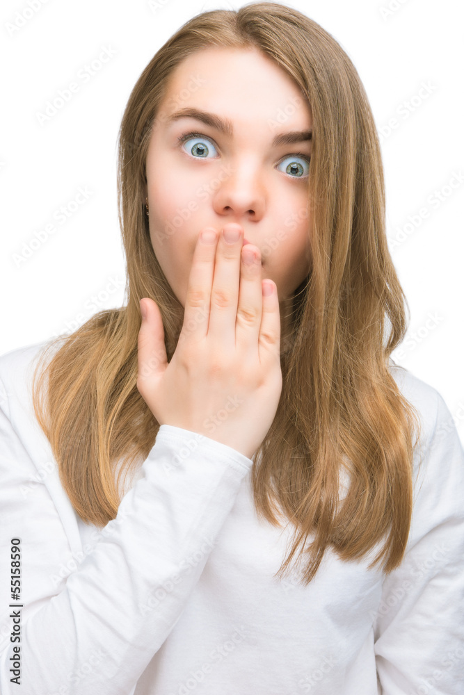 shocked and thrilled teenage girl with hand closing mouth shocked and thrilled teenage girl with hand closing mouth