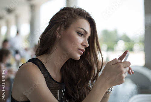 Woman sending a text message