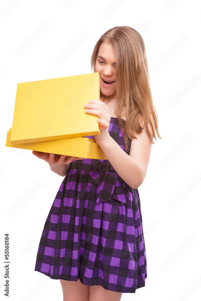 Portrait of young happy teen opening yellow box Portrait of young happy teen opening yellow box