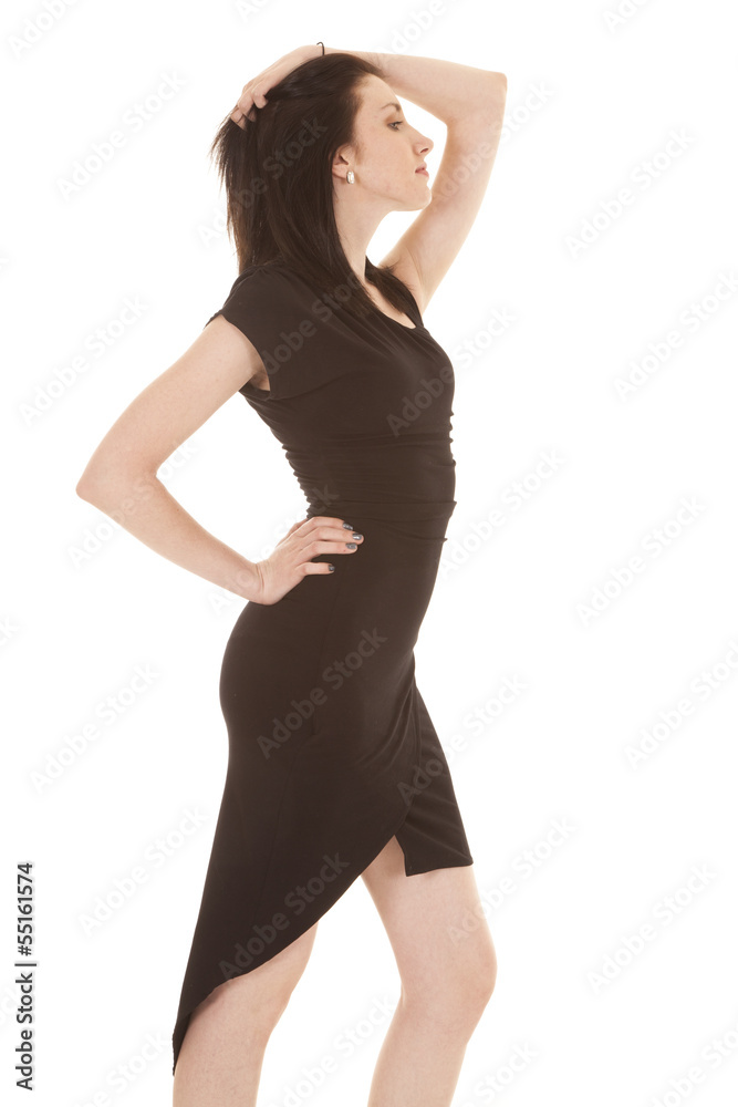 Fototapeta premium woman in a black dress hand on head and hip