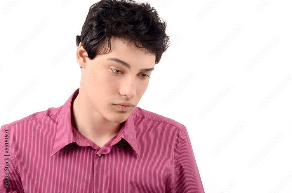 Sad unhappy young handsome business man looking down Sad unhappy young handsome business man looking down
