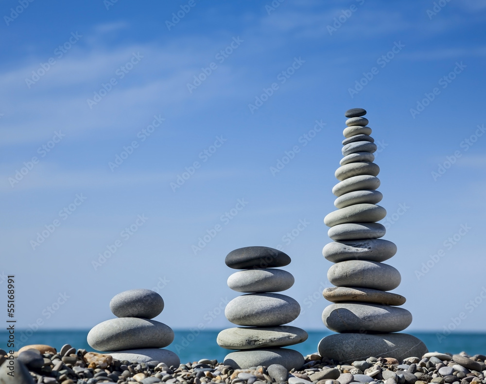 Fototapeta premium Three pyramids of stones for meditation