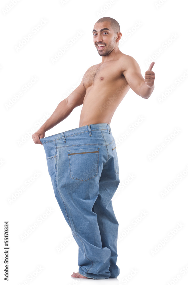 Fototapeta premium Man in dieting concept with oversized jeans