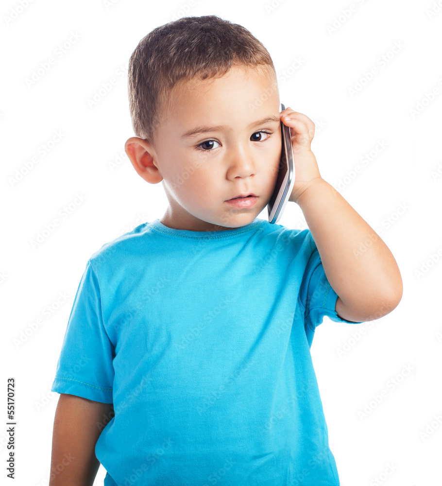 child calling by mobile with a white background child calling by mobile with a white background