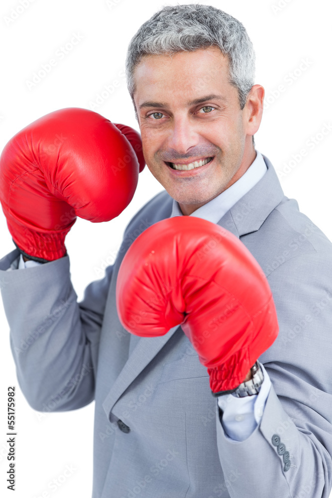 Happy businessman with boxing gloves Happy businessman with boxing gloves