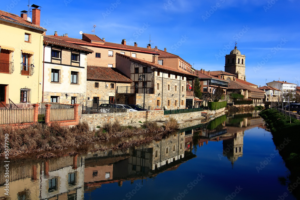 Landscape of river and village in Aguilar de Campo, famous for i