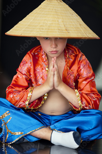 little boy with asian straw haat
