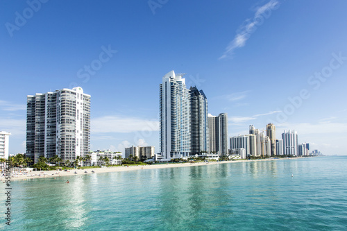 beautiful beach with condominiums and skyscraper in Sunny Island © travelview