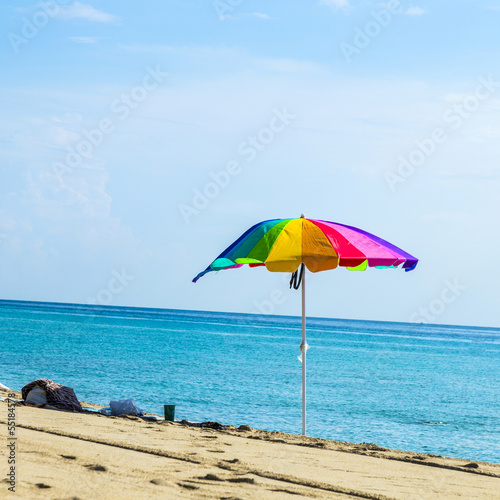beach umbrella colorful in the sand