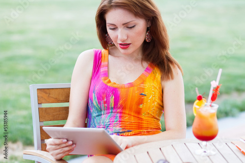 Young girl browsing trendy tablet pc photo