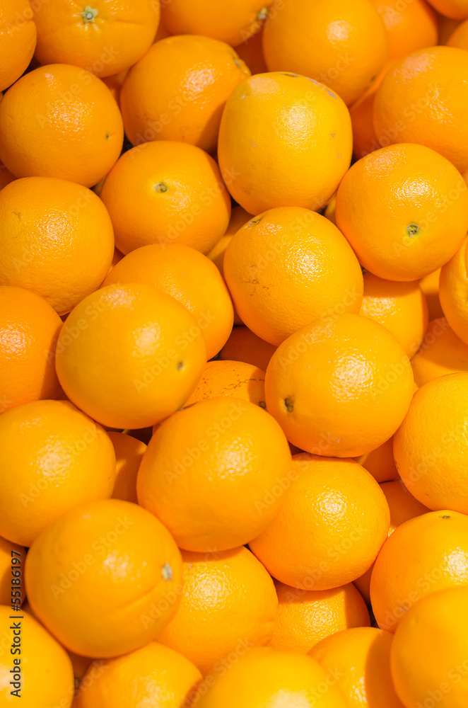 Lots of bright oranges in supermarket Lots of bright oranges in supermarket