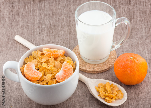 Healthy breakfast of milk, cornflakes and mandarin