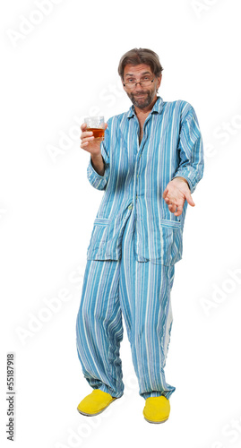 drunk man standing in pajamas with glass