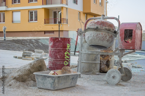 Cement mixer with barrel and plastic cement mixing trough photo