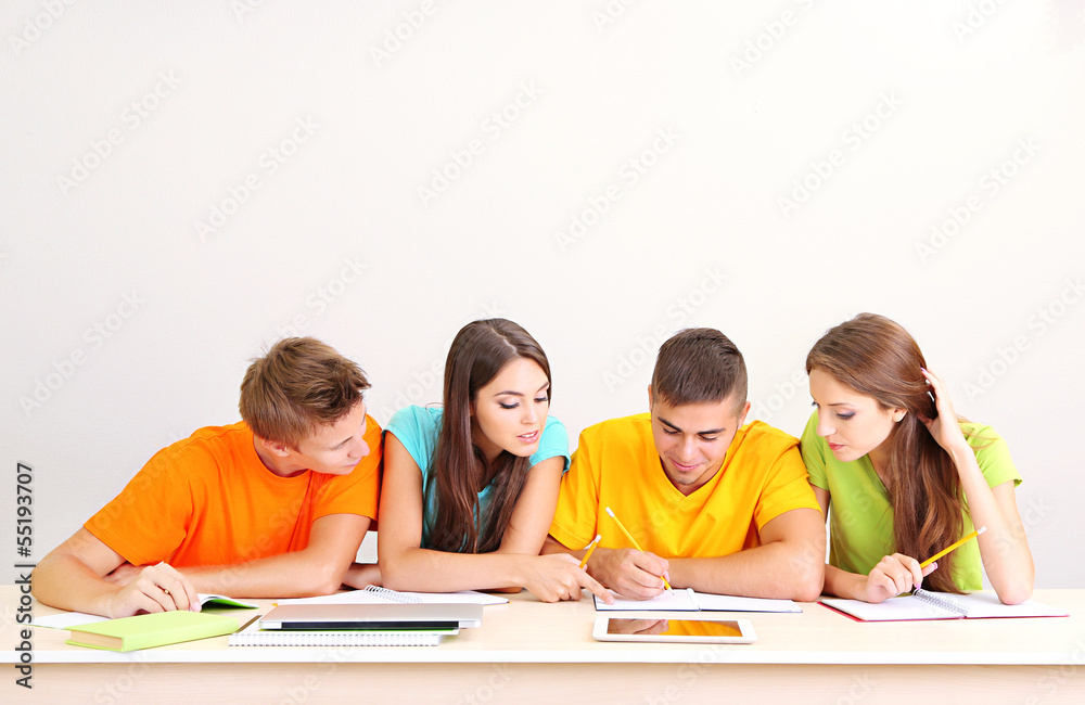 Group of young students sitting in the room Group of young students sitting in the room