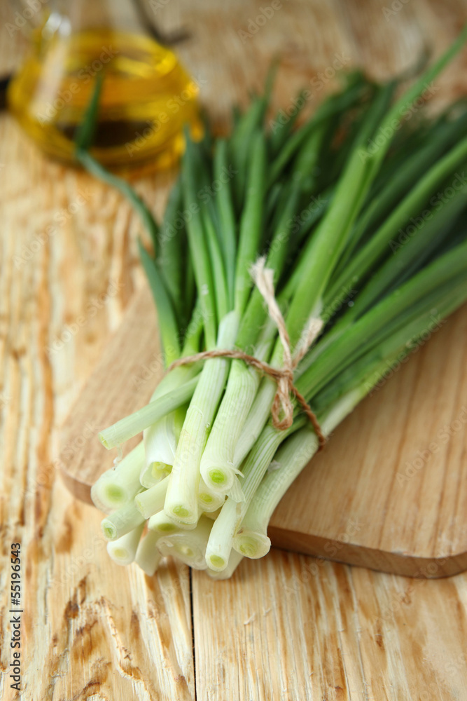bunch of green onions and vegetable oil for salad bunch of green onions and vegetable oil for salad